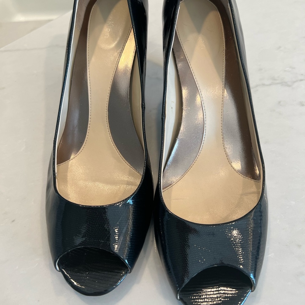 Calvin Klein black patent leather peep toe heels.  Size 11.